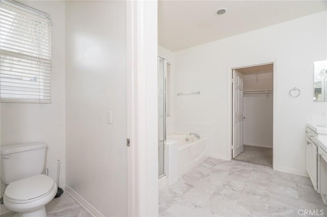 full bath with toilet, marble finish floor, baseboards, a bath, and vanity