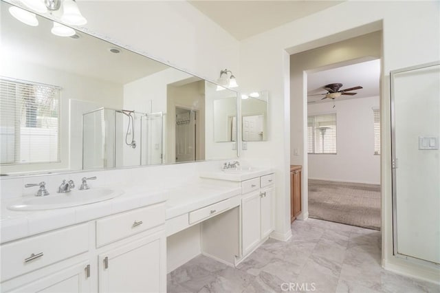 full bath with double vanity, a healthy amount of sunlight, and a sink