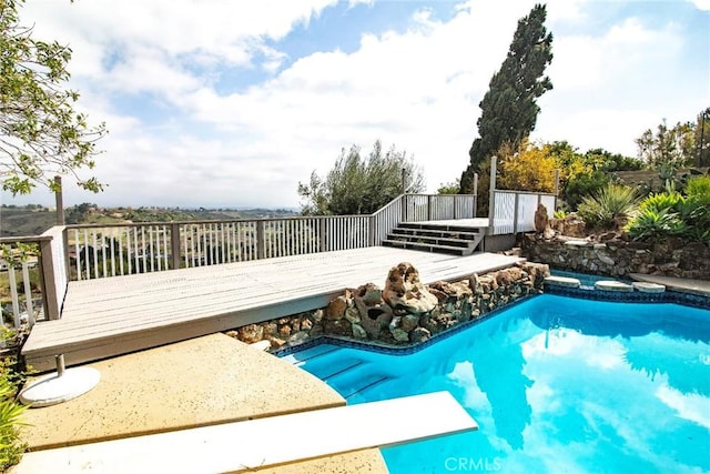 outdoor pool featuring a wooden deck