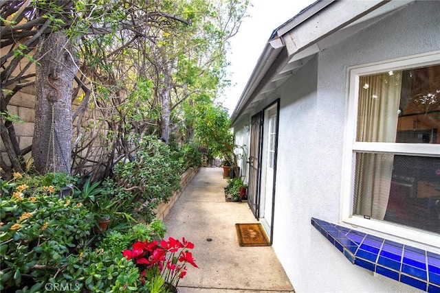 view of side of property featuring stucco siding