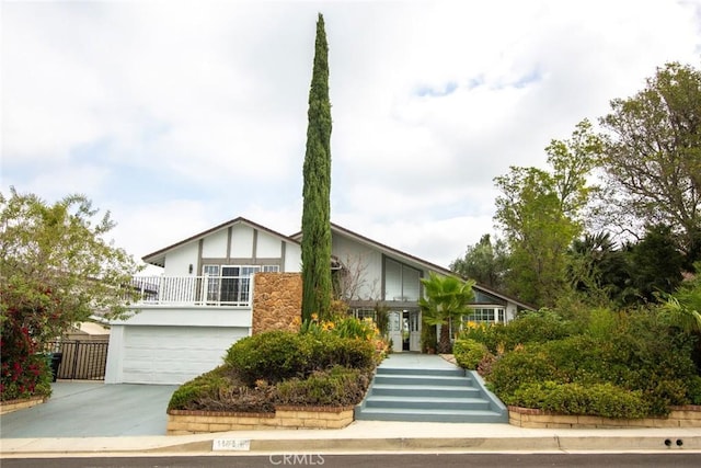 view of front facade featuring driveway and an attached garage