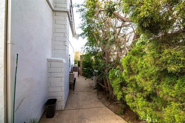 view of property exterior featuring cooling unit and stucco siding