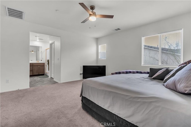 bedroom with visible vents, light carpet, baseboards, and ceiling fan