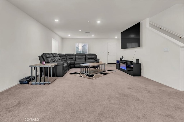 living area featuring recessed lighting, visible vents, and carpet floors