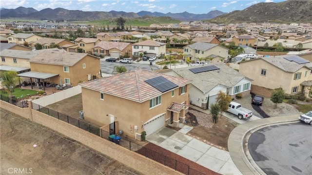 birds eye view of property featuring a mountain view and a residential view