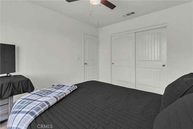 bedroom featuring visible vents, a closet, and a ceiling fan