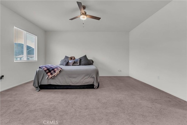 carpeted bedroom featuring a ceiling fan