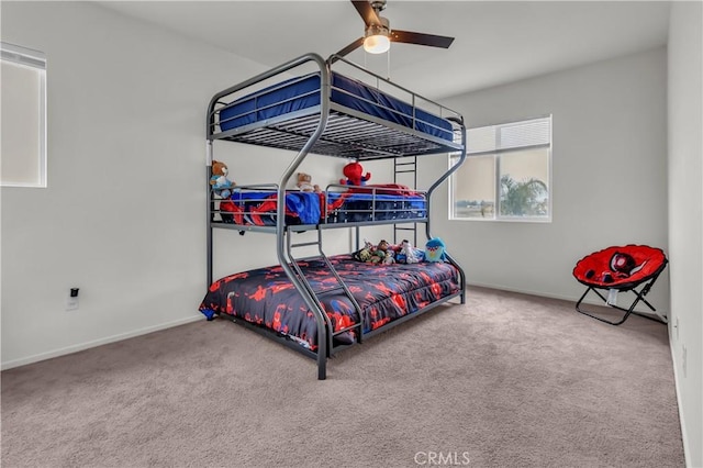 bedroom with carpet, baseboards, and ceiling fan