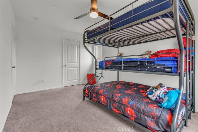 carpeted bedroom with a ceiling fan