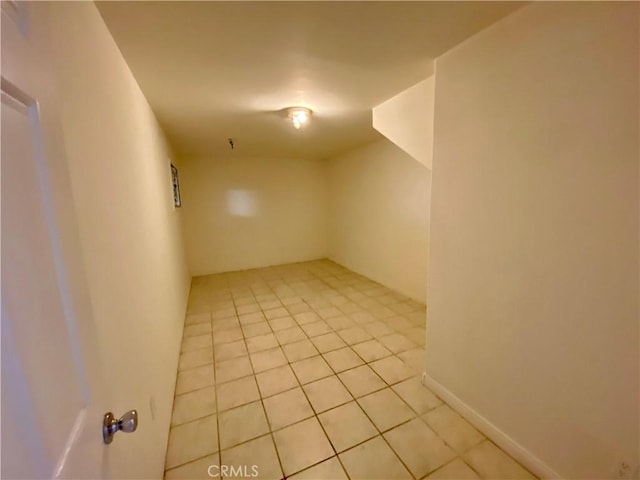 spare room featuring light tile patterned floors