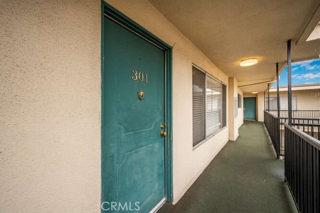 view of exterior entry featuring stucco siding