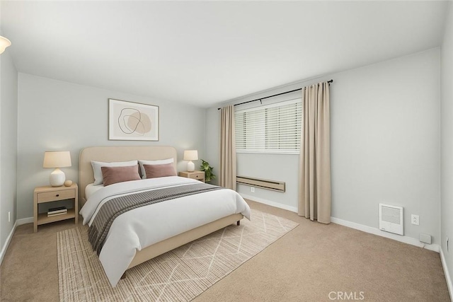 bedroom featuring light colored carpet, a baseboard radiator, and baseboards