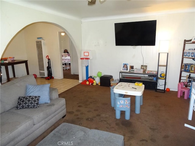 playroom with arched walkways and carpet floors