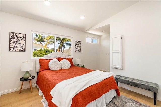 bedroom with recessed lighting, baseboards, light wood-style floors, and lofted ceiling