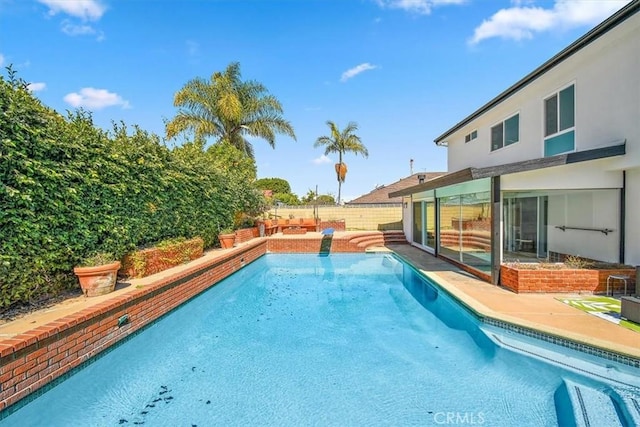 view of swimming pool with a patio, a fenced backyard, and a fenced in pool