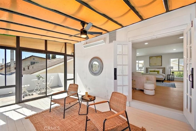 interior space with visible vents, ceiling fan, and french doors