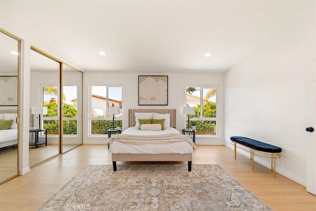 bedroom featuring recessed lighting, baseboards, and light wood finished floors