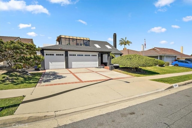 view of front facade with an attached garage and driveway