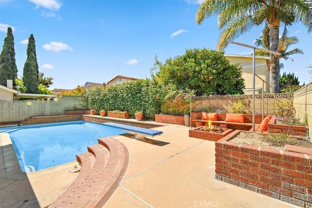 view of pool featuring a patio area and a fenced backyard