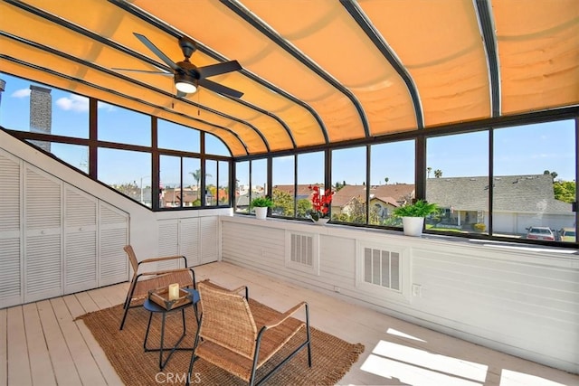 sunroom with visible vents and a ceiling fan