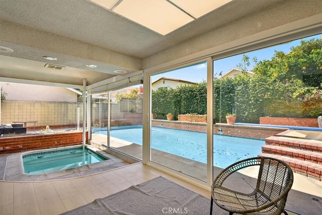 outdoor pool with an in ground hot tub