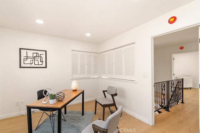 office area with recessed lighting, baseboards, and light wood-style floors