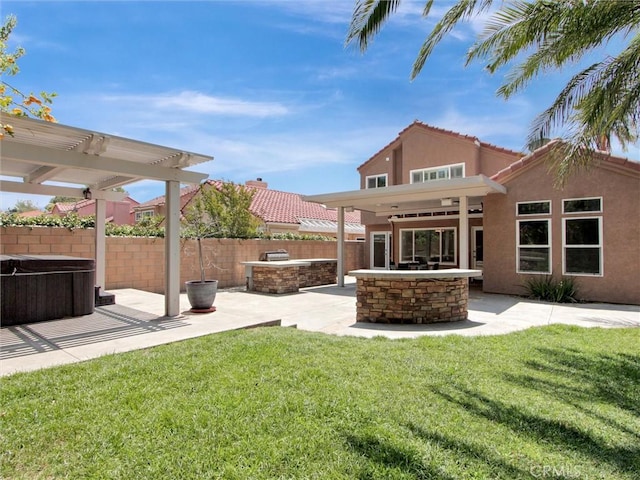 25547 Palermo Way, Yorba Linda, CA 92887 - fenced backyard featuring a hot tub, an outdoor kitchen, a patio, and a pergola