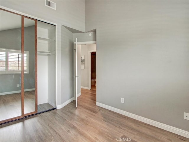 25547 Palermo Way, Yorba Linda, CA 92887 - unfurnished bedroom with wood finished floors and a closet
