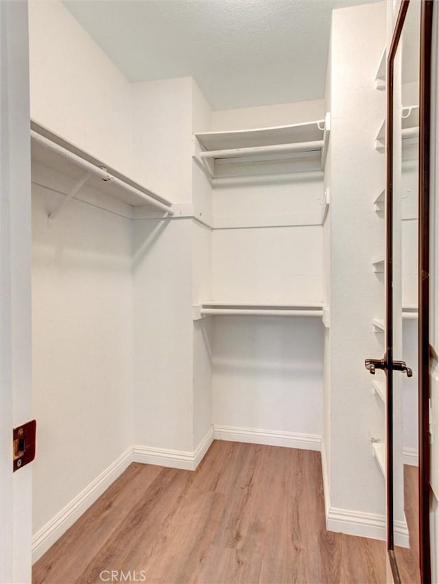 25547 Palermo Way, Yorba Linda, CA 92887 - walk in closet featuring wood finished floors