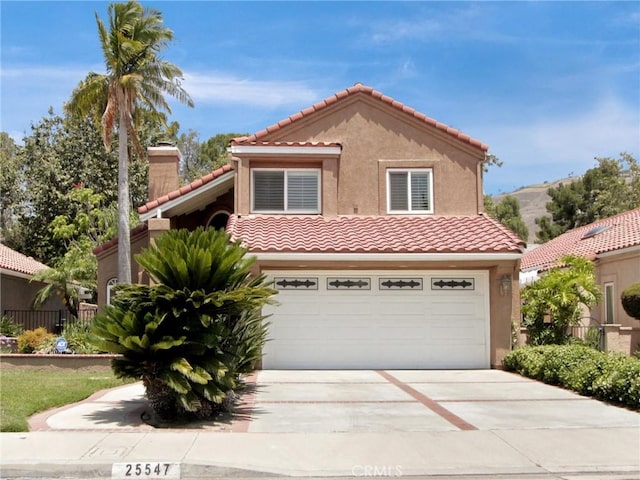 25547 Palermo Way, Yorba Linda, CA 92887 - mediterranean / spanish-style home with a tiled roof, concrete driveway, stucco siding, and a garage