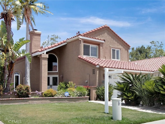 25547 Palermo Way, Yorba Linda, CA 92887 - mediterranean / spanish-style house featuring a tiled roof, a chimney, a front lawn, and stucco siding