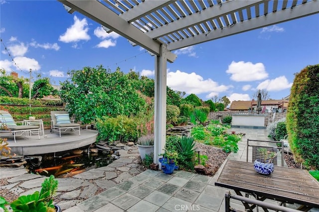 view of patio with outdoor dining space and a pergola