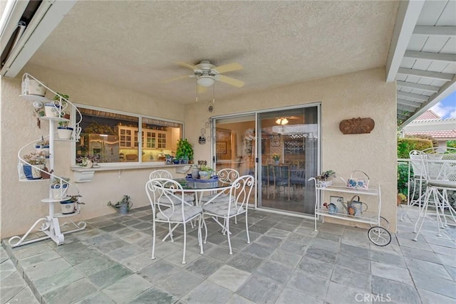 view of patio / terrace featuring outdoor dining area and ceiling fan