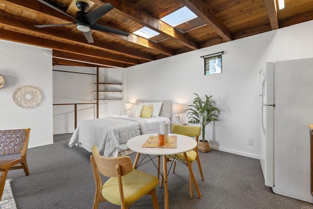 carpeted bedroom featuring wooden ceiling, beamed ceiling, baseboards, and freestanding refrigerator