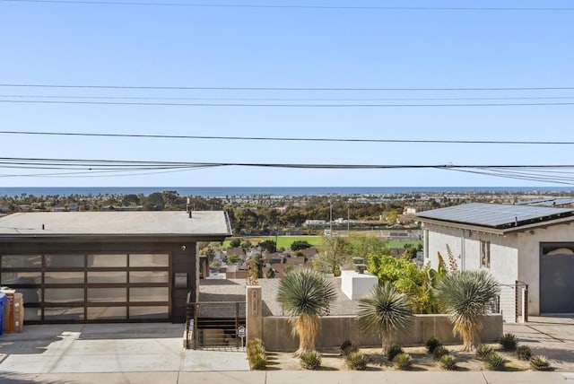 view of patio / terrace with a garage and concrete driveway