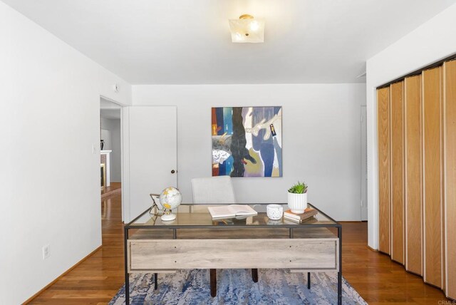 home office with wood finished floors