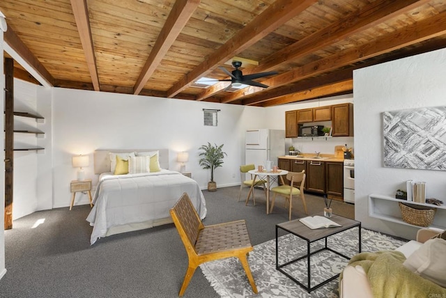 bedroom with a skylight, freestanding refrigerator, a sink, wooden ceiling, and beamed ceiling