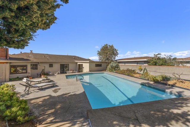 view of pool featuring a patio area and a fenced in pool