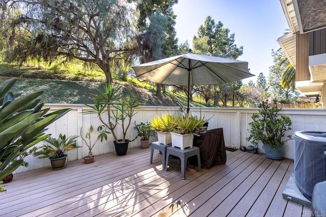 wooden deck with central AC unit