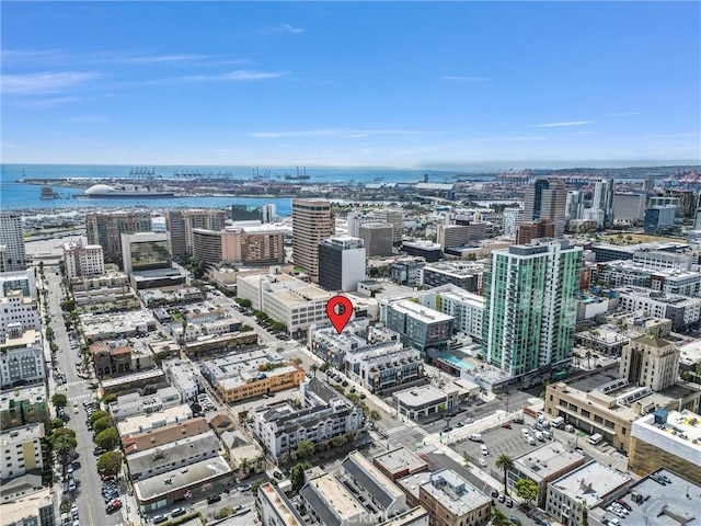 bird's eye view featuring a water view and a city view