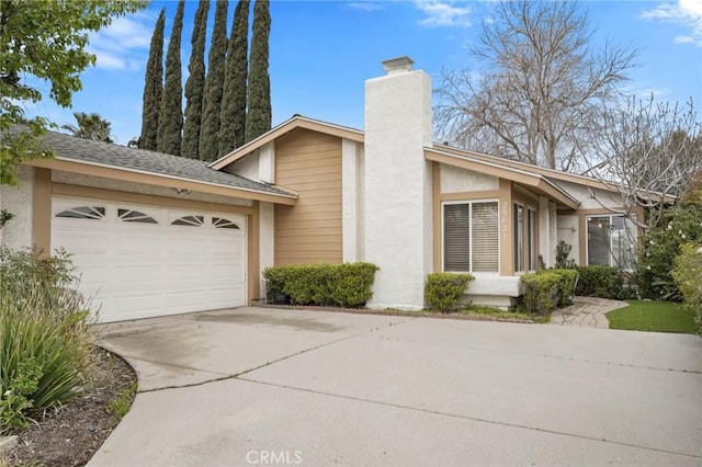 mid-century inspired home featuring an attached garage, a shingled roof, stucco siding, concrete driveway, and a chimney