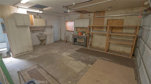 below grade area with a garage and a sink