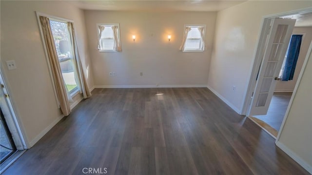 interior space featuring dark wood-style floors and baseboards