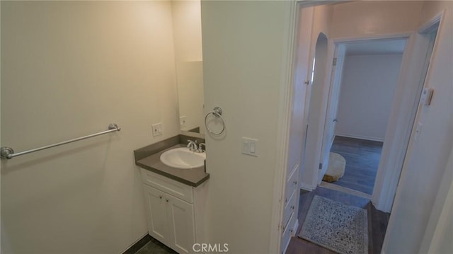 bathroom with vanity and baseboards