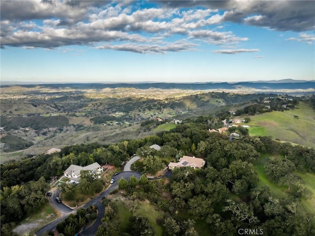 aerial view featuring a mountain view and a wooded view