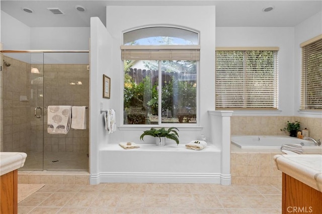 full bath featuring a bath, vanity, and a shower stall