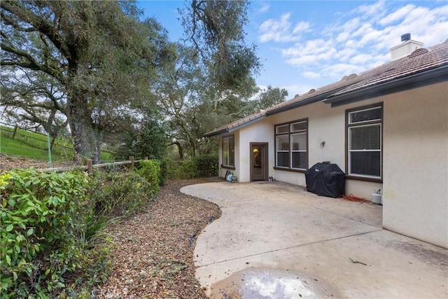 view of yard featuring fence and a patio