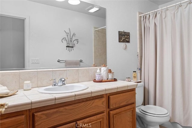 full bath featuring vanity, curtained shower, and toilet