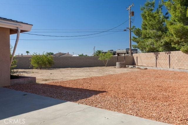 view of yard with a fenced backyard