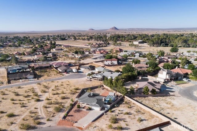 drone / aerial view with a mountain view and a desert view